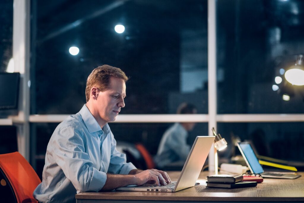 Man working with laptop in office